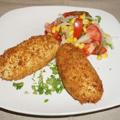 A picture of Chilean stuffed potatoes with beef.