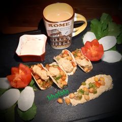 A picture of Bread hummus tacos.