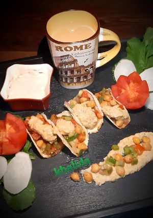 A picture of Bread hummus tacos.