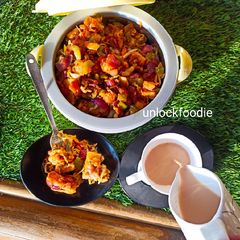 A picture of Fried Plain Dhokla (without sugar) with veggies and Sauce.