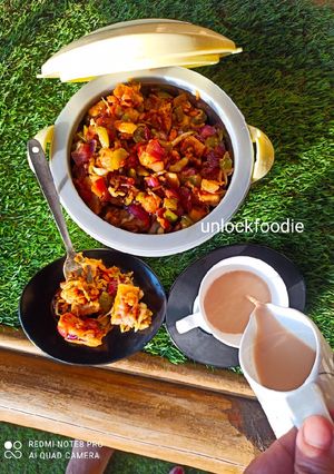 A picture of Fried Plain Dhokla (without sugar) with veggies and Sauce.