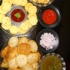 A picture of Dal coin with Pani Puri.