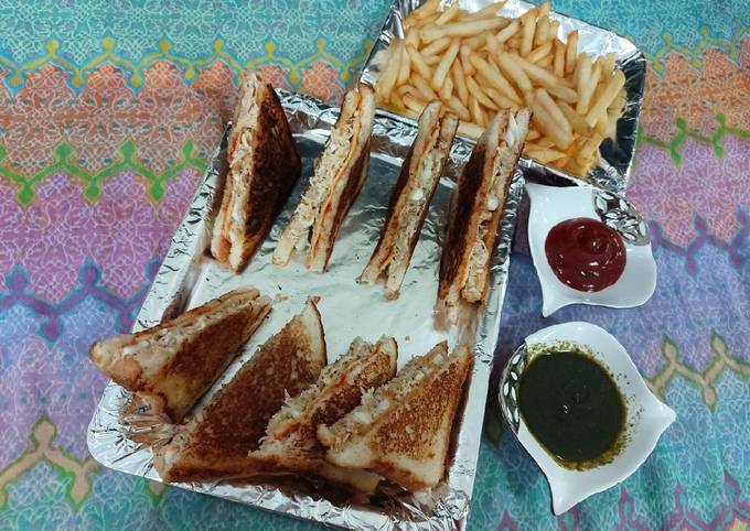 Chicken and eggs cheese sandwiches with french fries