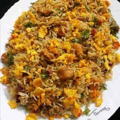 A picture of Chinese Masala Rice with Tandoori Chicken.