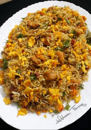 A picture of Chinese Masala Rice with Tandoori Chicken.