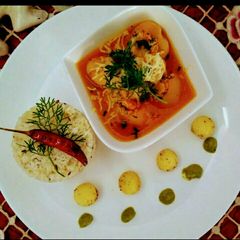 Paneer stuffing potatoes in Orange juice A picture of Paneer stuffing potatoes in Orange juice.