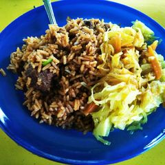 A picture of Beef Biryani and Coleslaw.