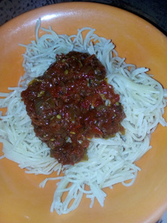 A picture of Spaghetti with sauce.