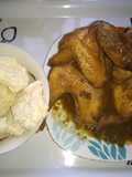 Tapioca (kpokpo garri) and local chicken sauce