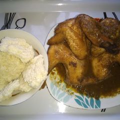 A picture of Tapioca (kpokpo garri) and local chicken sauce.