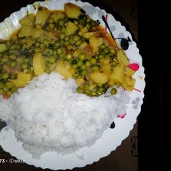 A picture of Boiled rice served with minji stew and potatoes.