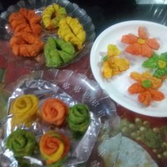A picture of Mava Gujiya and flower Mathri.