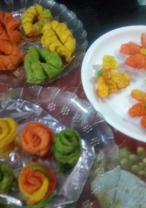 A picture of Mava Gujiya and flower Mathri.