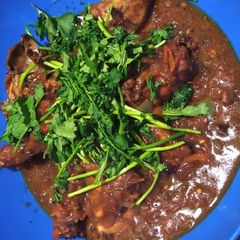 A picture of Marinaded chicken with sauce.
