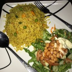 A picture of Fried rice with salad.