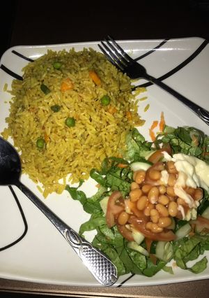 A picture of Fried rice with salad.