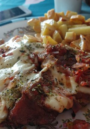 Una foto de Vacío de cerdo a la pizza