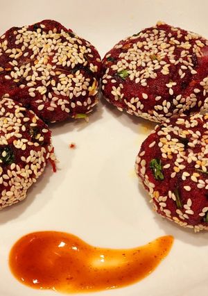 A picture of Beetroot Tikki or Patties with Sesame Seeds.