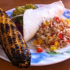 A picture of Tortillas with Refried Beans and Spicy Rice.