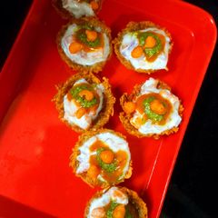 A picture of Baked Aloo Katori chaat.