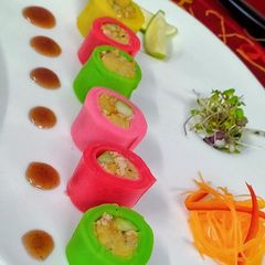 A picture of Steamed Crepe Rolls & Lentils Cake served with Date Sauce.