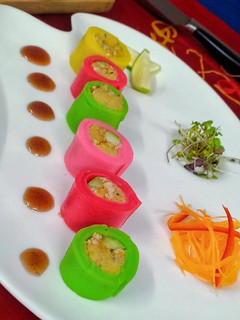 A picture of Steamed Crepe Rolls & Lentils Cake served with Date Sauce.