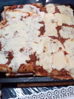 Una foto de Canelones con salsa blanca y queso!!