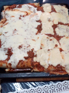 Una foto de Canelones con salsa blanca y queso!!