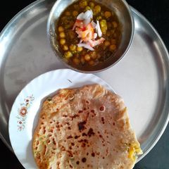 A picture of Mint mutter with paneer  paratha.