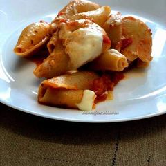 A picture of Pasta shells in red sauce.