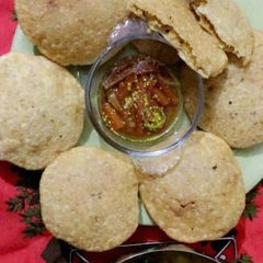Daal kachori with aloo bhaji +gajar moli ka pani wala achar A picture of Daal kachori with aloo bhaji +gajar moli ka pani wala achar.