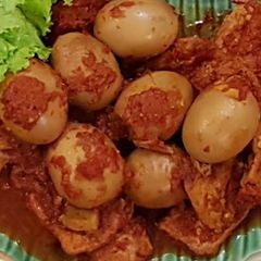 A picture of Spiced Egg And Tofu (Telur Tahu Bumbu Bali).