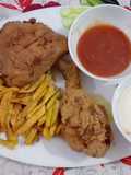 Crispy fried chicken with mayo garlic sauce ketchup and fries