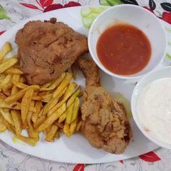 A picture of Crispy fried chicken with mayo garlic sauce ketchup and fries.