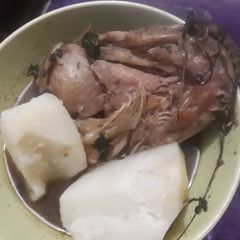 A picture of Boiled yam and catfish pepper soup.