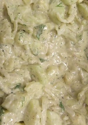 A picture of Cucumber salad with alkaline ranch dressing.