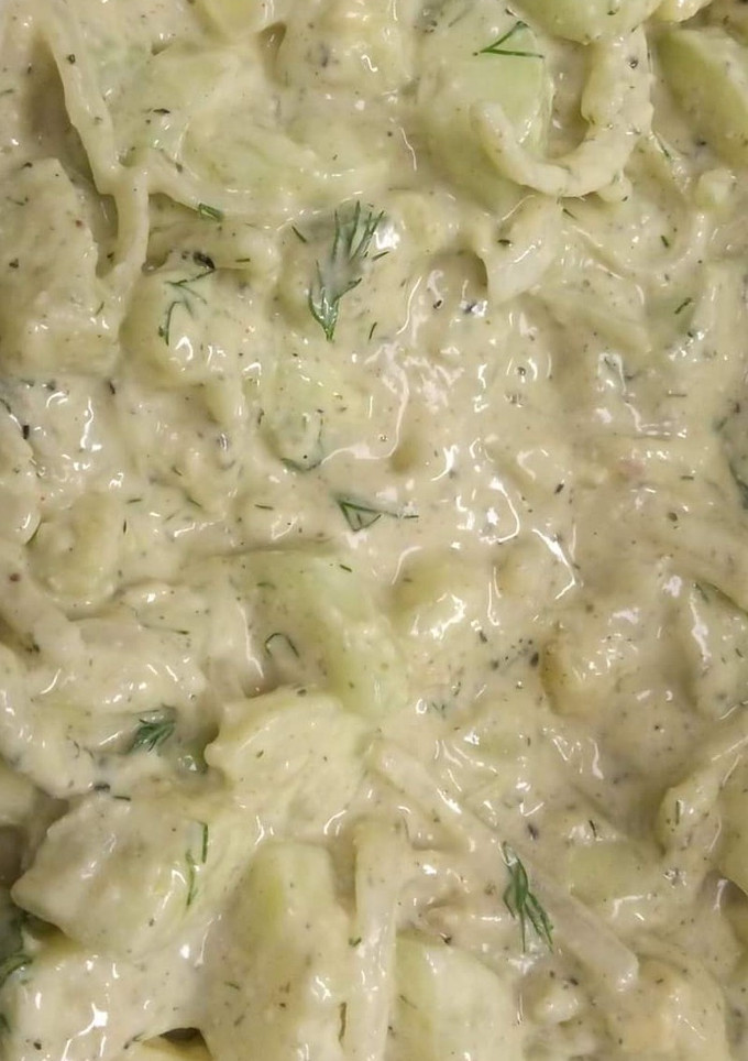 A picture of Cucumber salad with alkaline ranch dressing.