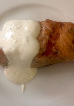 A picture of Grilled salmon with creamy horseradish sauce.