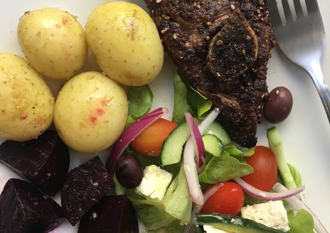 Roasted dukkah spiced lamb chops with baby potatoes and salad