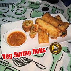 A picture of Veg Spring Rolls with homemade sheets and sauce.