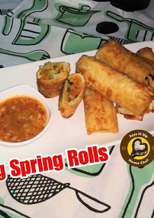 A picture of Veg Spring Rolls with homemade sheets and sauce.