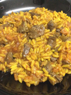 Una foto de Arroz con higaditos de pollo