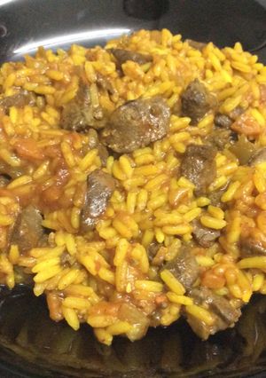 Una foto de Arroz con higaditos de pollo