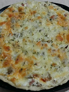 Una foto de Pizza carbonara