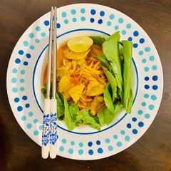 A picture of Laksa - spicy coconut noodle soup from Malaysia 🇲🇾.