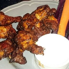 A picture of sticky bbq hot wings.