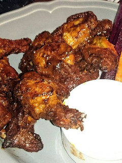 A picture of sticky bbq hot wings.