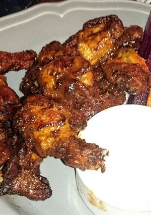 A picture of sticky bbq hot wings.