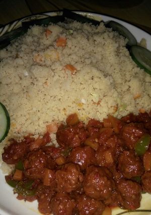 A picture of Stir fry couscous with meat balls stew.