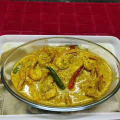 A picture of Chingri Bhapa or Steamed Prawns in Coconut Mustard Paste.